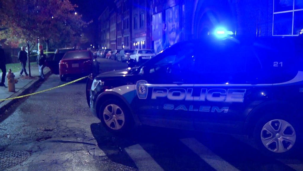 An officer of the Salem Police Department opened fire overnight when a man in a red sedan tried to run them down, officials said.