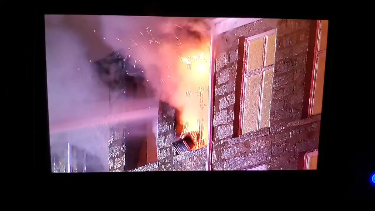 Fire visible on the 5th floor of a mill building on County St in Fall River
