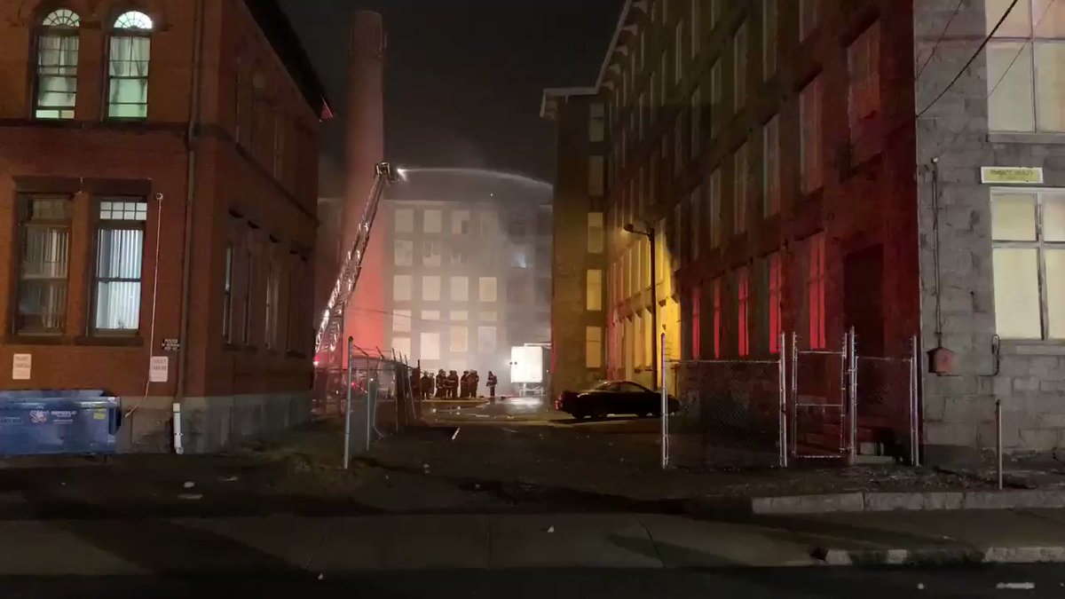 Firefighters still putting water on the Stafford Mill that burst into flames around midnight