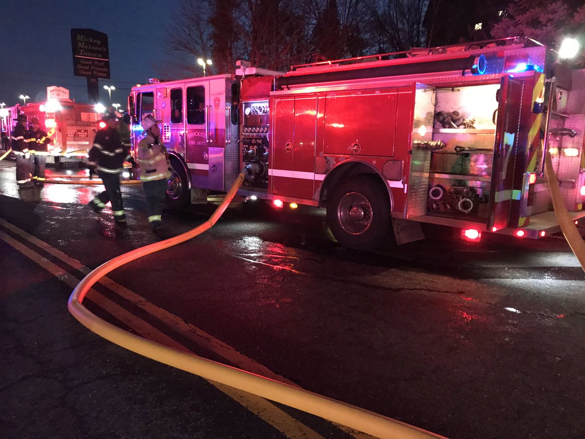 N. Pearl St. at the Stoughton line. Brockton firefighters fighting a trash truck fire extend to several cars.