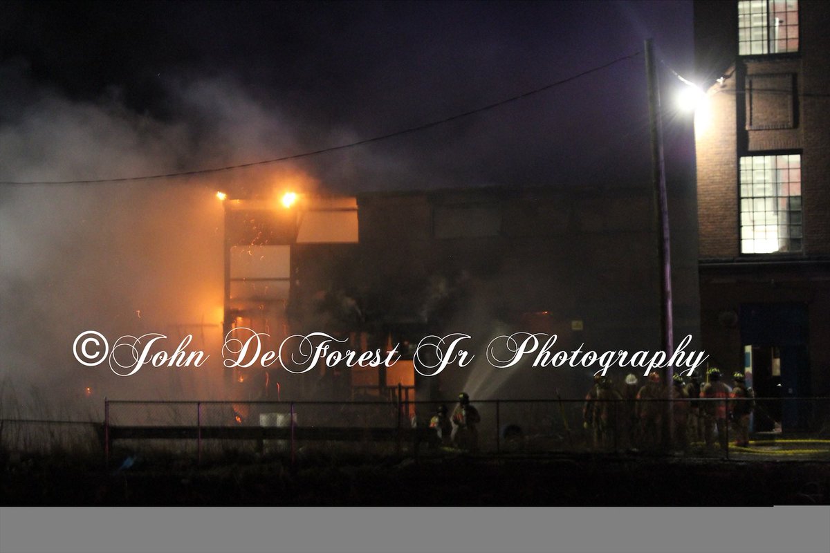 Holyoke ma FF's were called to 108 Cabot Street On 4-1-20 just before 10:30pm for a building fire. Upon arrival crews found a 2 story vacant loading dock area building attached to a 4 story mill well involved and a 2nd alarm was called.