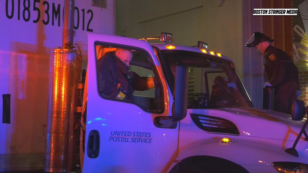 USPS driver on D street had a supposed heart attack while driving and crashed into a parked BMW. The driver of the semi was pronounced dead at the scene. 