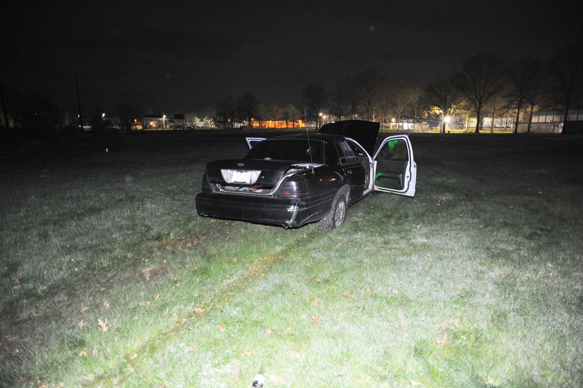 Ford Crown Victoria car crashes through fence on Benham Street onto baseball field at East Middle School in Brockton