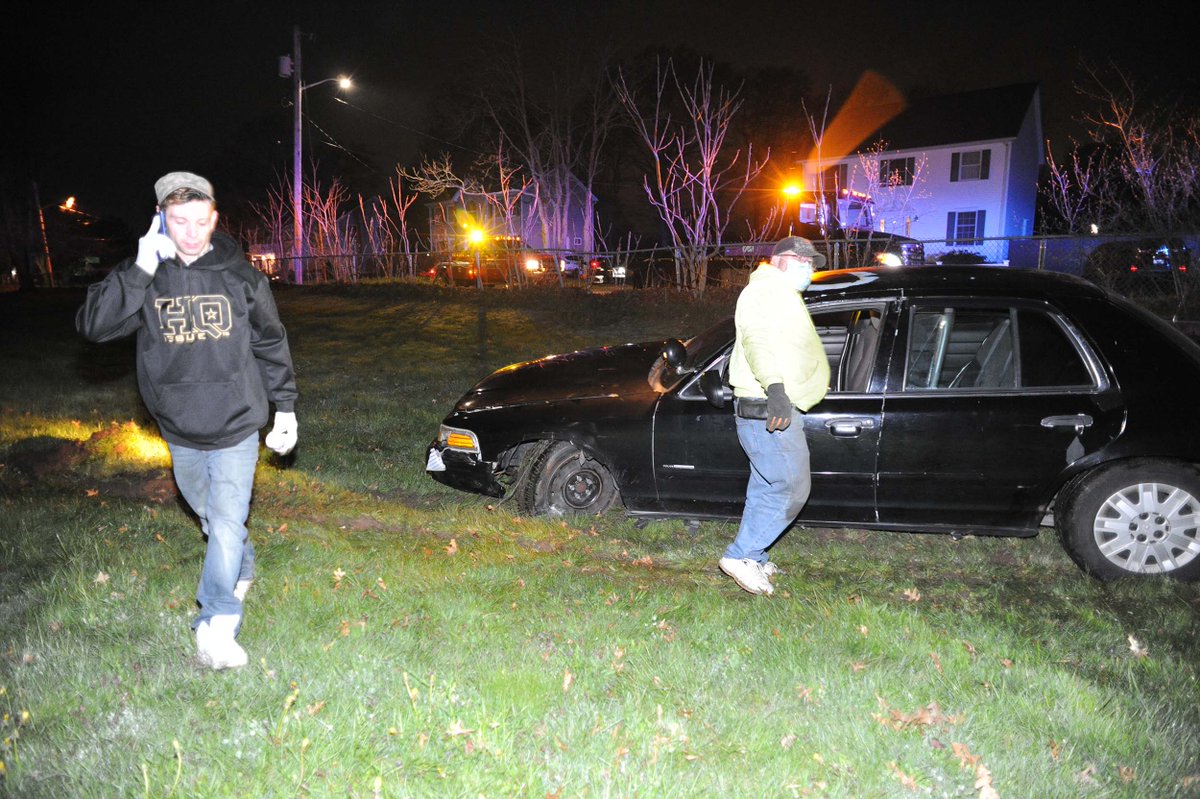 Ford Crown Victoria car crashes through fence on Benham Street onto baseball field at East Middle School in Brockton