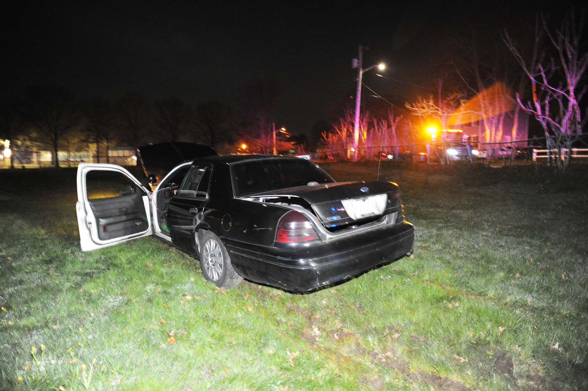 Ford Crown Victoria car crashes through fence on Benham Street onto baseball field at East Middle School in Brockton