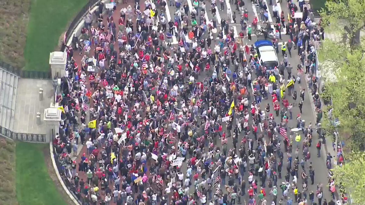 Protesters gather outside of the Massachusetts State House calling for the Governor to reopen the state and protesting the state's lockdown order