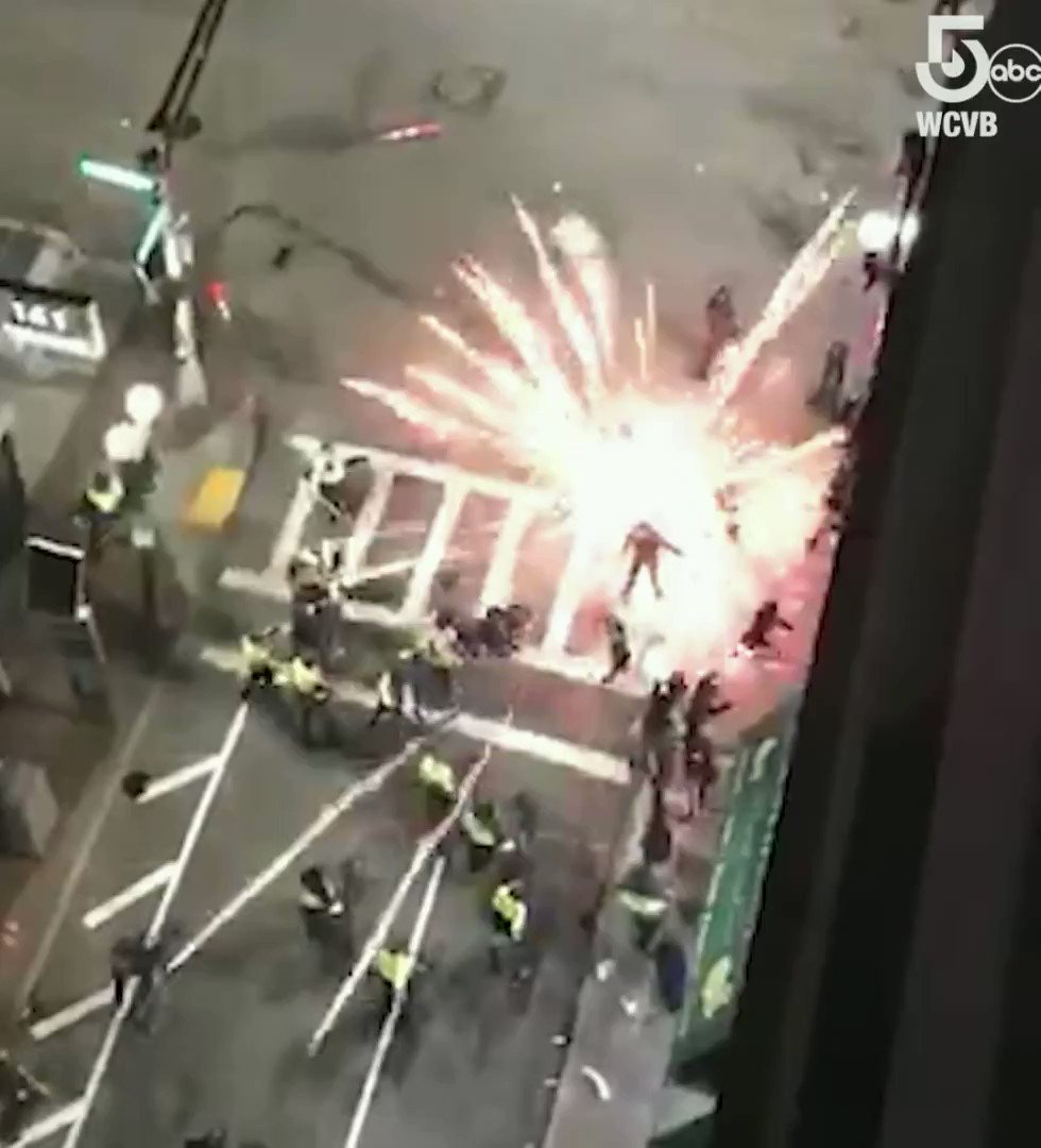 This video shows an explosive device being thrown next to several people, including Boston officers, off Tremont Street in Boston following protests Sunday night.  #BostonProtests 