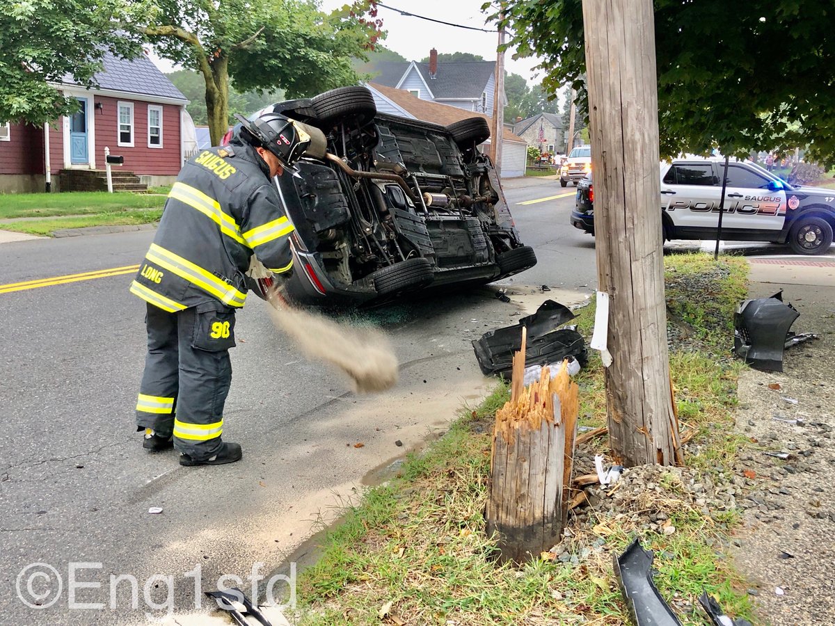 Saugus MA, Rollover car accident at 119 Main Street,striking a utility