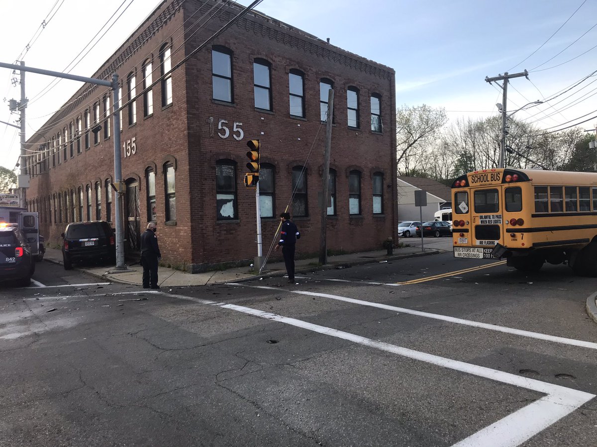 Brockton firefighters on scene of a motor vehicle accident at Crescent and Commercial streets. An unoccupied (no students) school bus collided with a motor vehicle which in turn hit a building