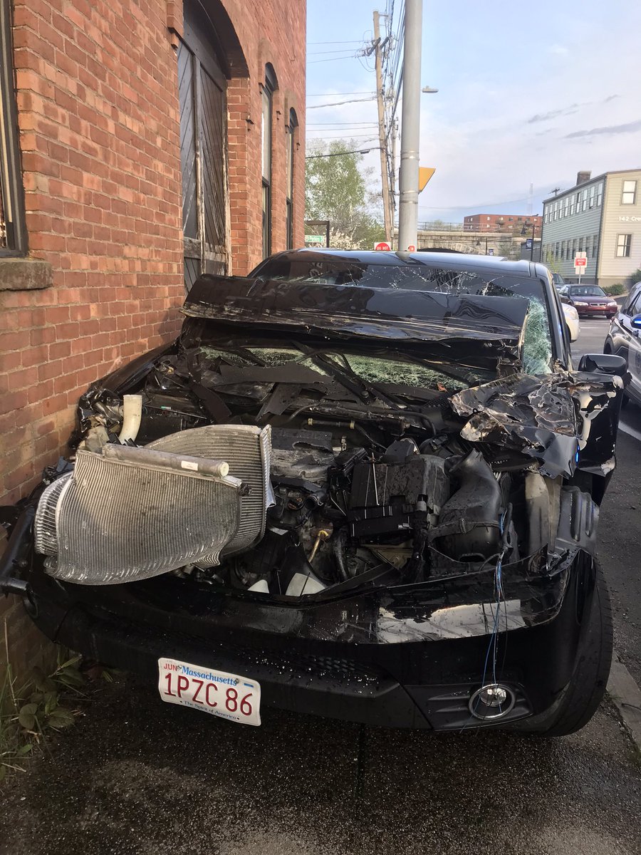 Brockton firefighters on scene of a motor vehicle accident at Crescent and Commercial streets. An unoccupied (no students) school bus collided with a motor vehicle which in turn hit a building