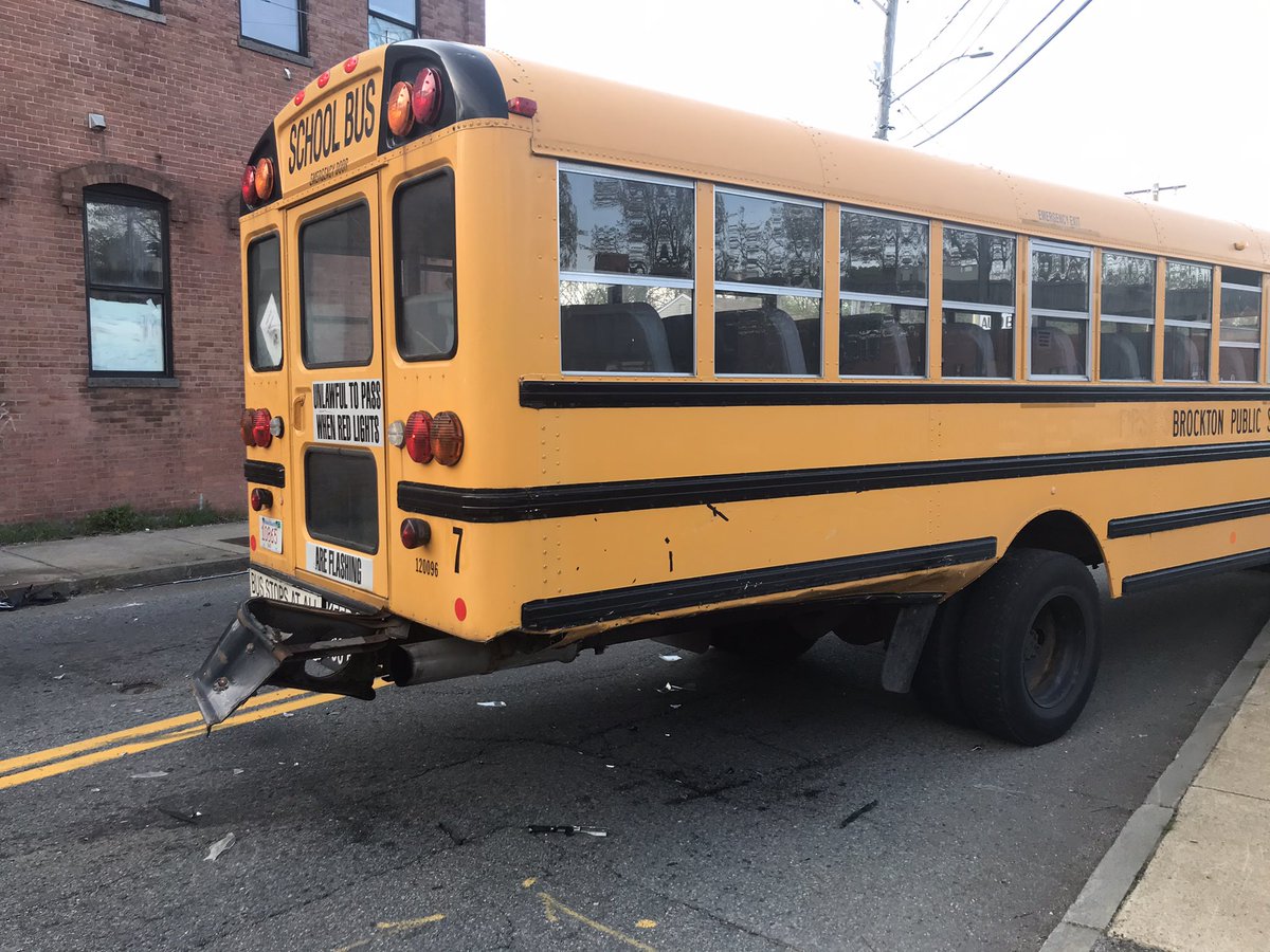 Brockton firefighters on scene of a motor vehicle accident at Crescent and Commercial streets. An unoccupied (no students) school bus collided with a motor vehicle which in turn hit a building