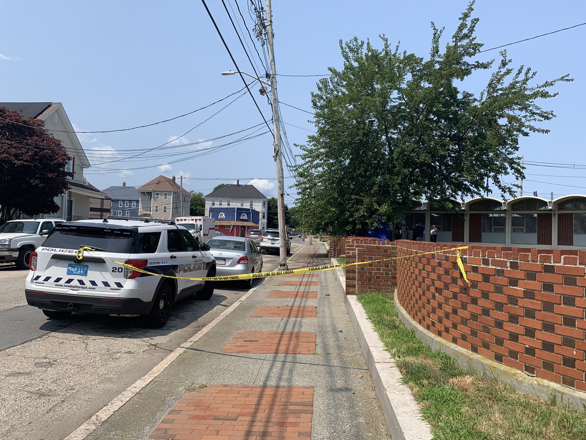 New Bedford Police have blocked off the back side of the Howland Green Library, not releasing any details yet  but we can see the investigation is centered around a blue tent.  There is a backpack and a purse on the ground near it