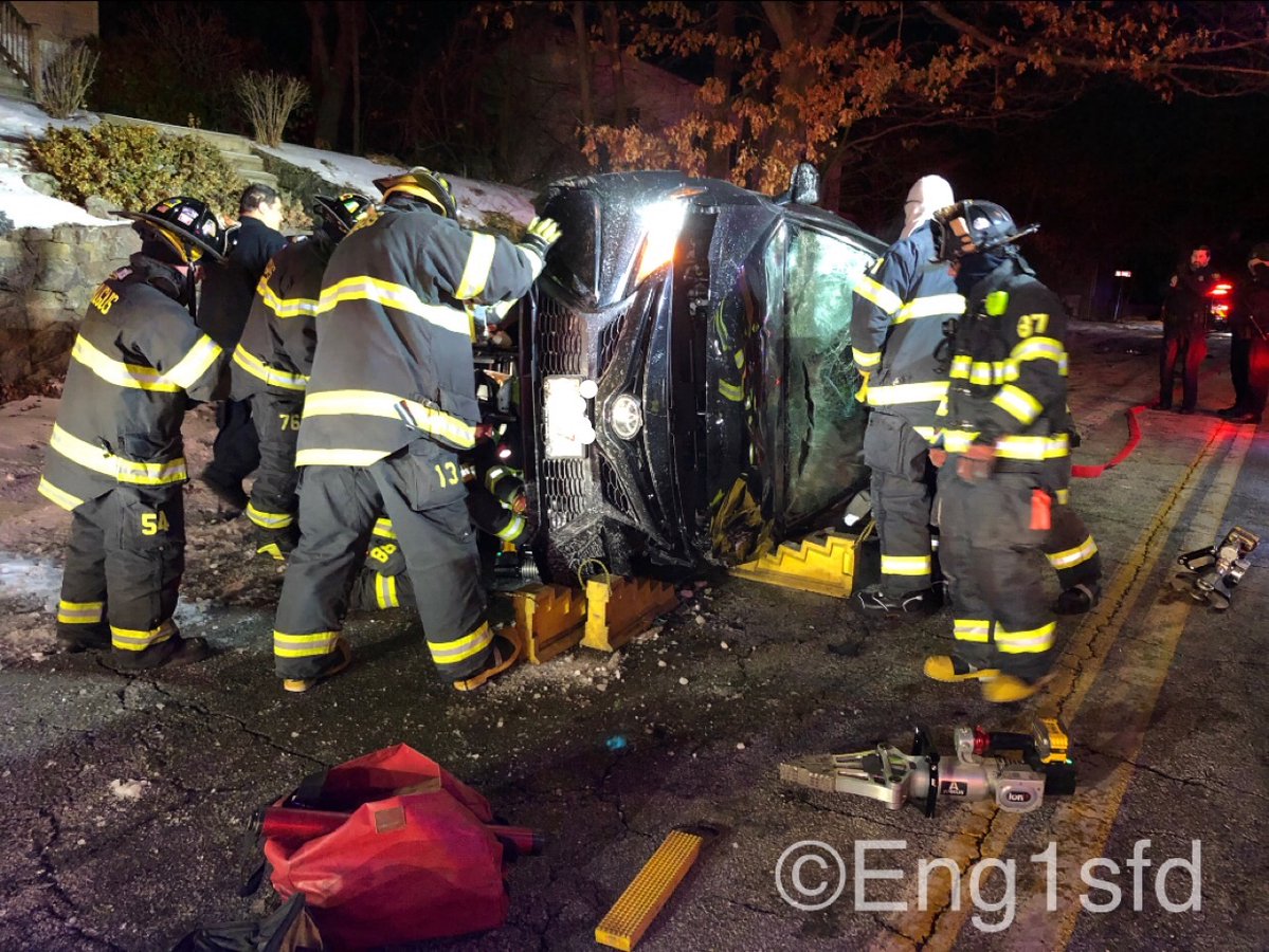 Saugus MA, 2 car accident @ 39 Elm Street with one car flipped on its side with the driver trapped. Fire fighters stabilized the car and extricated the driver that sustained minor injuries and was transported to the hospital. occupants of the other car were not injured