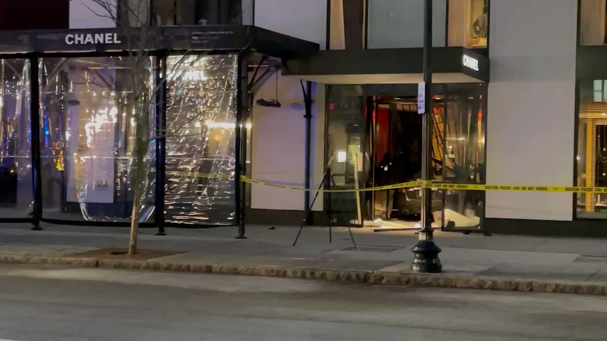 A car has slammed into the Chanel store on Newbury Street in Boston.  Investigators are inside taking pictures as the store's alarm goes off.