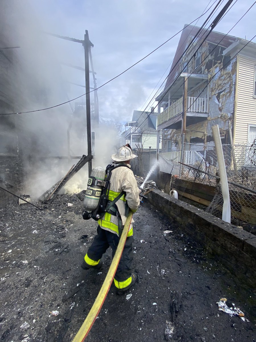 Boston Fire Dept.:The rear porches have collapsed the are 2 exposure buildings on Corona St. Companies are  dealing with live wires in the rear of the building. A 4th alarm has been ordered