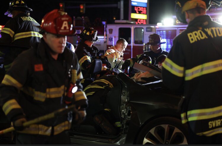 Brockton firefighters use the Jaws of Life hydraulic power tools to pry a woman from inside a car that crashed into a utility pole in front of the Rodeway Inn, 1005 Belmont st.