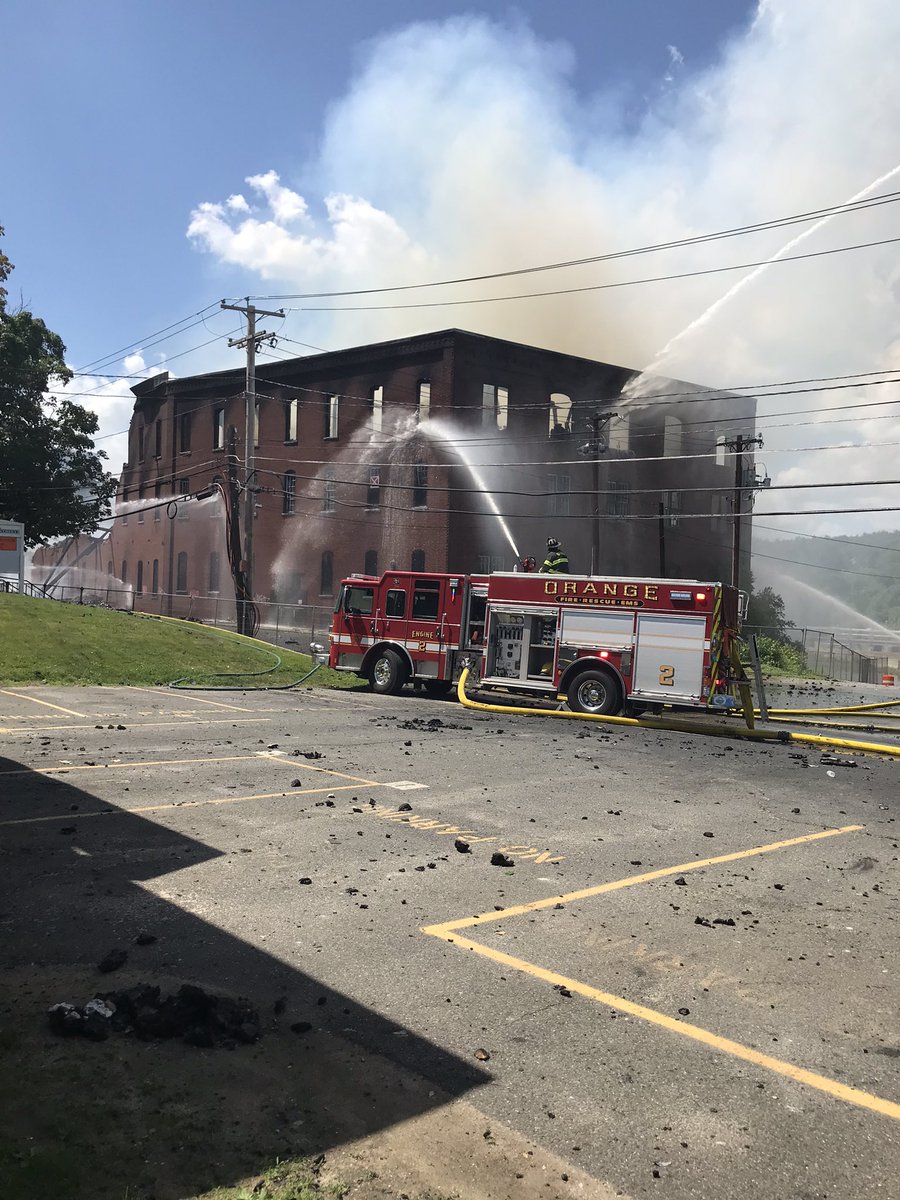 Scene in Orange, MA on W. River St. Crews are defensive. 7 ladder pipes and multiple hand lines going