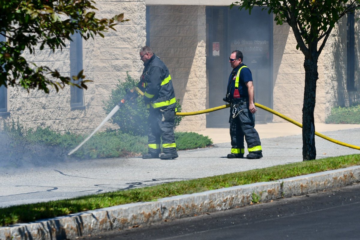 Lawrence E6 from Tower Hill handling a mulch fire on Glenn St while other companies are working at a water incident