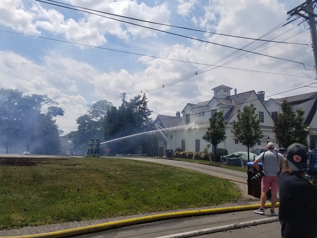 Still an active scene here in Hingham. A four-alarm fire destroyed a home on Mann Street. Nearby homes are being wet down due to heat and debris. The side and attic for the home next door were scorched