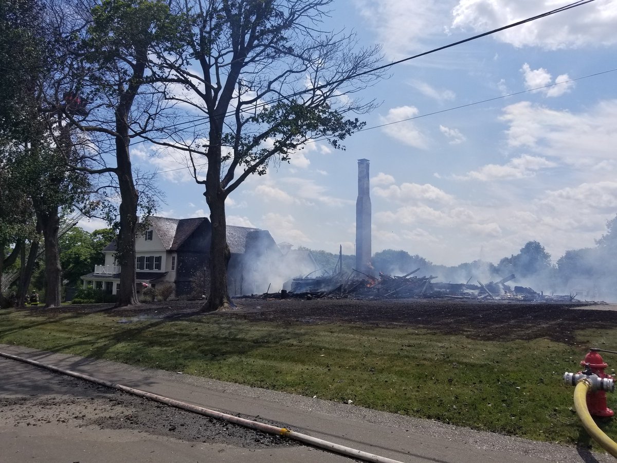 Still an active scene here in Hingham. A four-alarm fire destroyed a home on Mann Street. Nearby homes are being wet down due to heat and debris. The side and attic for the home next door were scorched