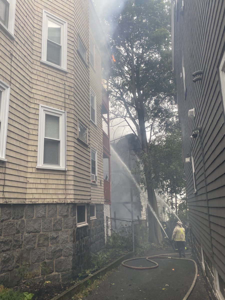 Boston Fire Dept.:The fire has traveled to multiple streets Peverell and Cushion Ave . The fire on CushionAve in in the 4rd floor and in the roof . All companies are working