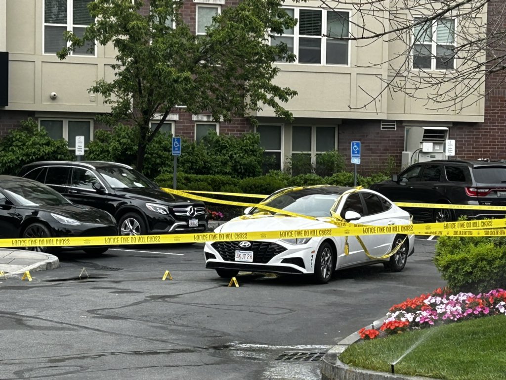 Investigators have this white sedan wrapped in crime scene tape. @MaldenPolice have been investigating in the lobby and out in the parking lot