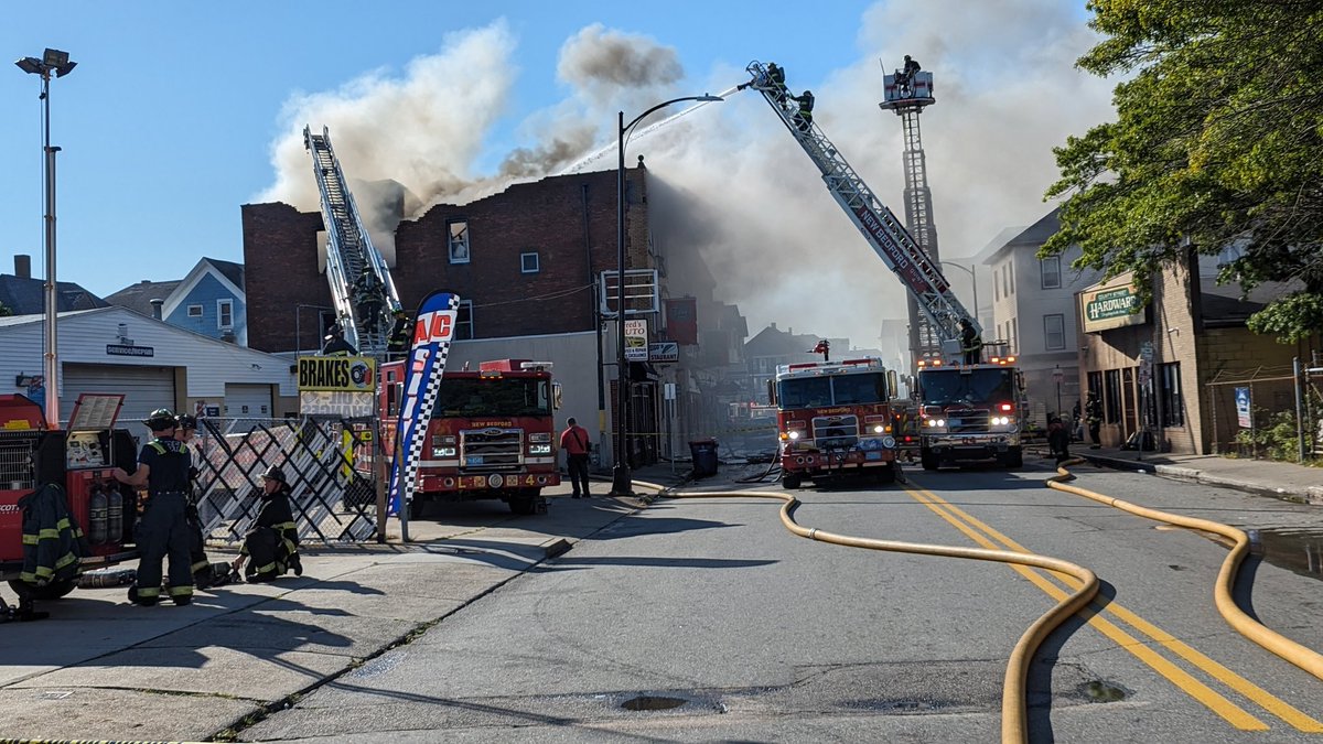 Large fire still being fought in New Bedford on county st    