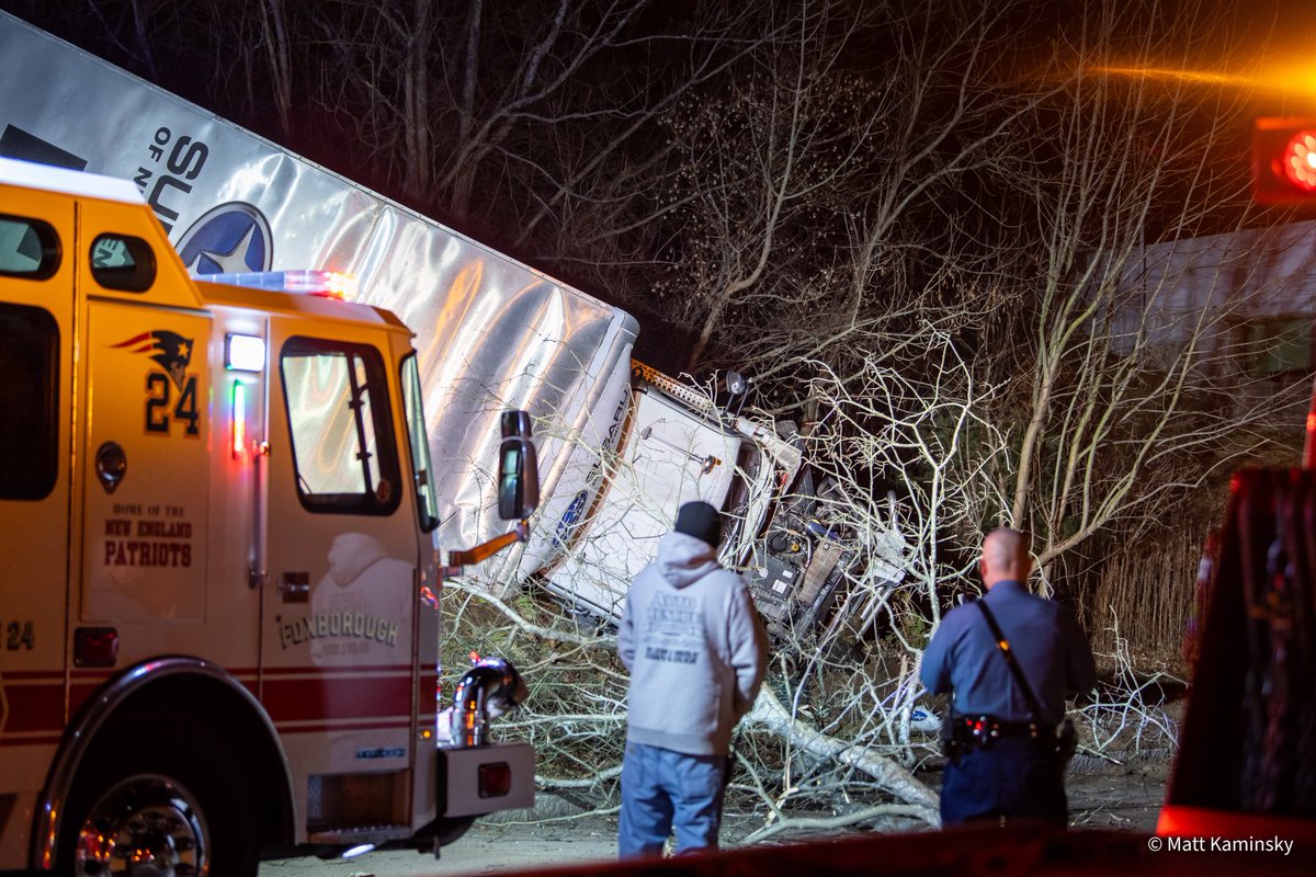 FOXBORO, MA - Earlier this evening just after 9:00 PM a semi truck traveling on 95 SB in Foxboro crashed through a barrier and rolled over off the highway, down onto Cocasset St in Foxboro