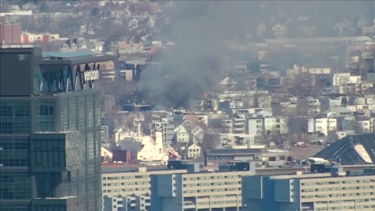 A plume of heavy smoke rising from a fire happening now in a Chelsea neighborhood is visible on several of our cameras in Boston