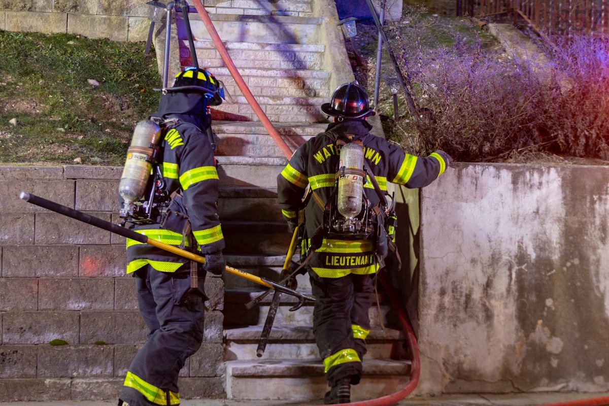 Watertown Firefighters open up at a working fire earlier tonight. Fire was located in the ceiling/insulation between the 2nd floor and the attic of a 2.5 sty woodframe on Keenan St