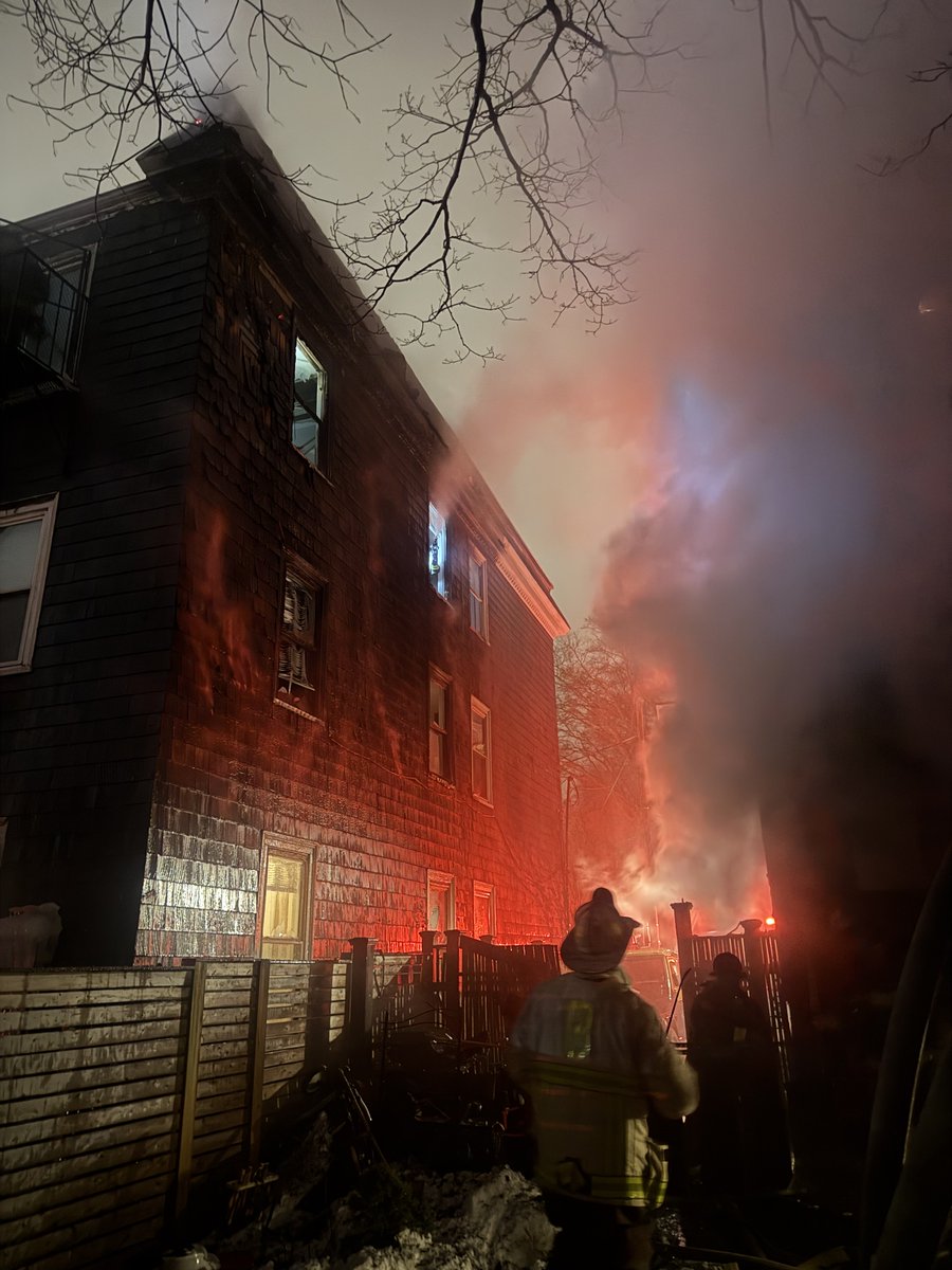 heavy fire in an occupied 3 story house at 98 Wyman st.The fire extended to the adjacent house at 100 Wyman .A 2nd and 3rd alarm was ordered