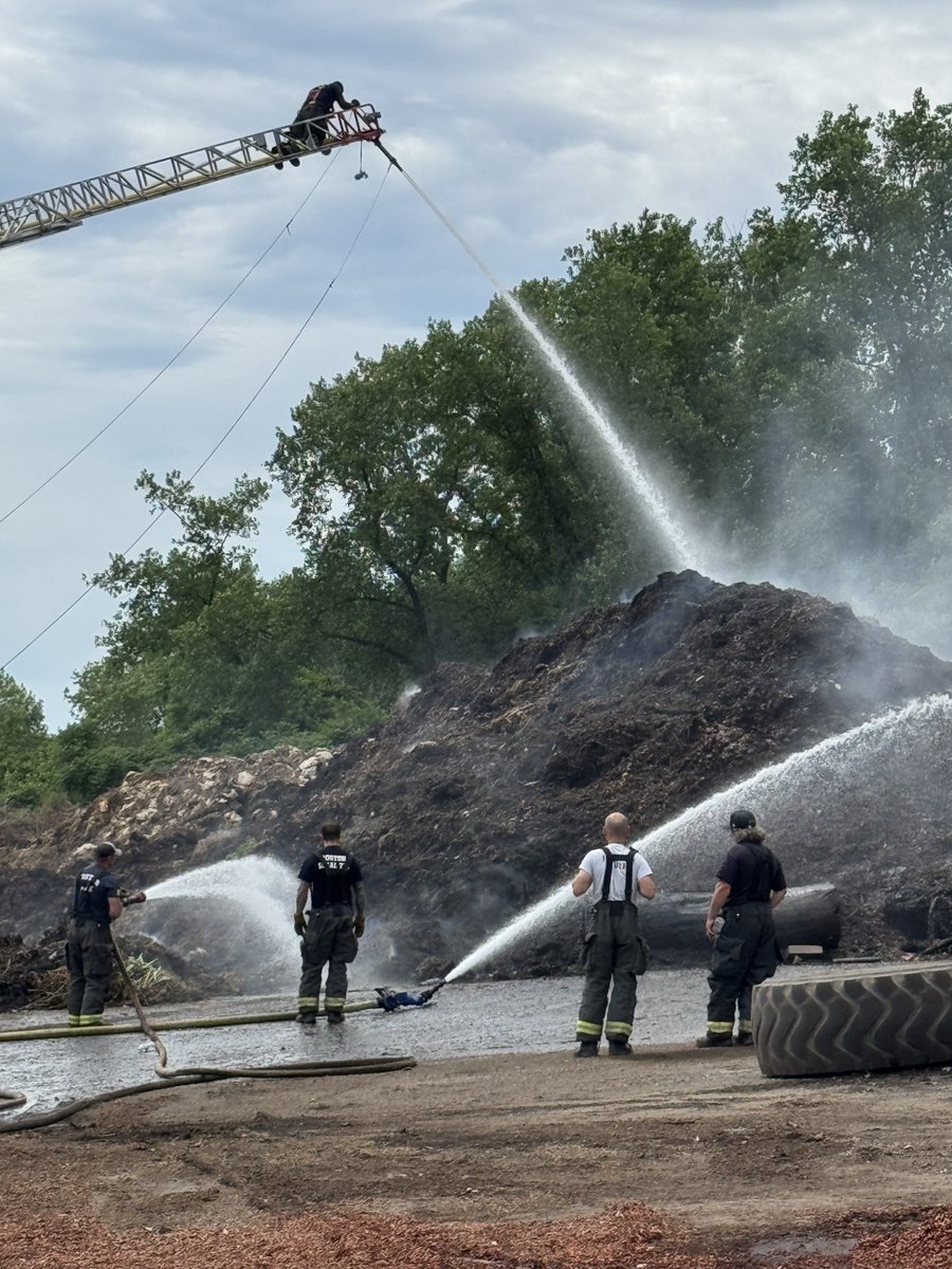 Firefighters are working at a large mulch fire at the landscape company on American Legion Hwy. Firefighters used 1000’s of feet of hose line to supply water to the fire. 
