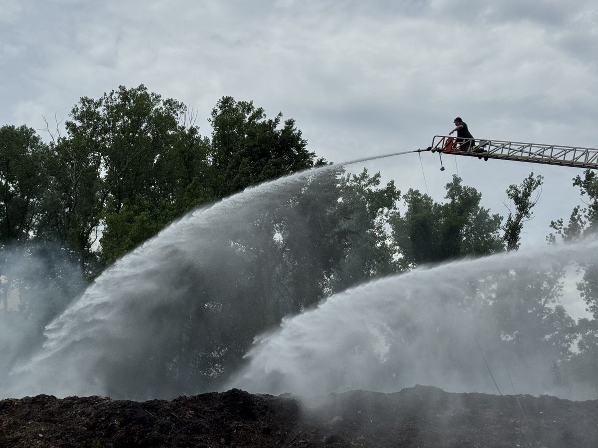 Firefighters are working at a large mulch fire at the landscape company on American Legion Hwy. Firefighters used 1000’s of feet of hose line to supply water to the fire. 
