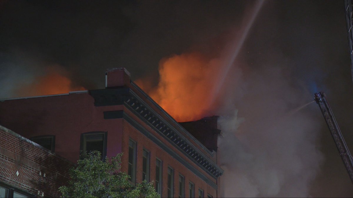 Crews are still on the scene hours after fire broke out at a commercial building on Rodman St in Fall River